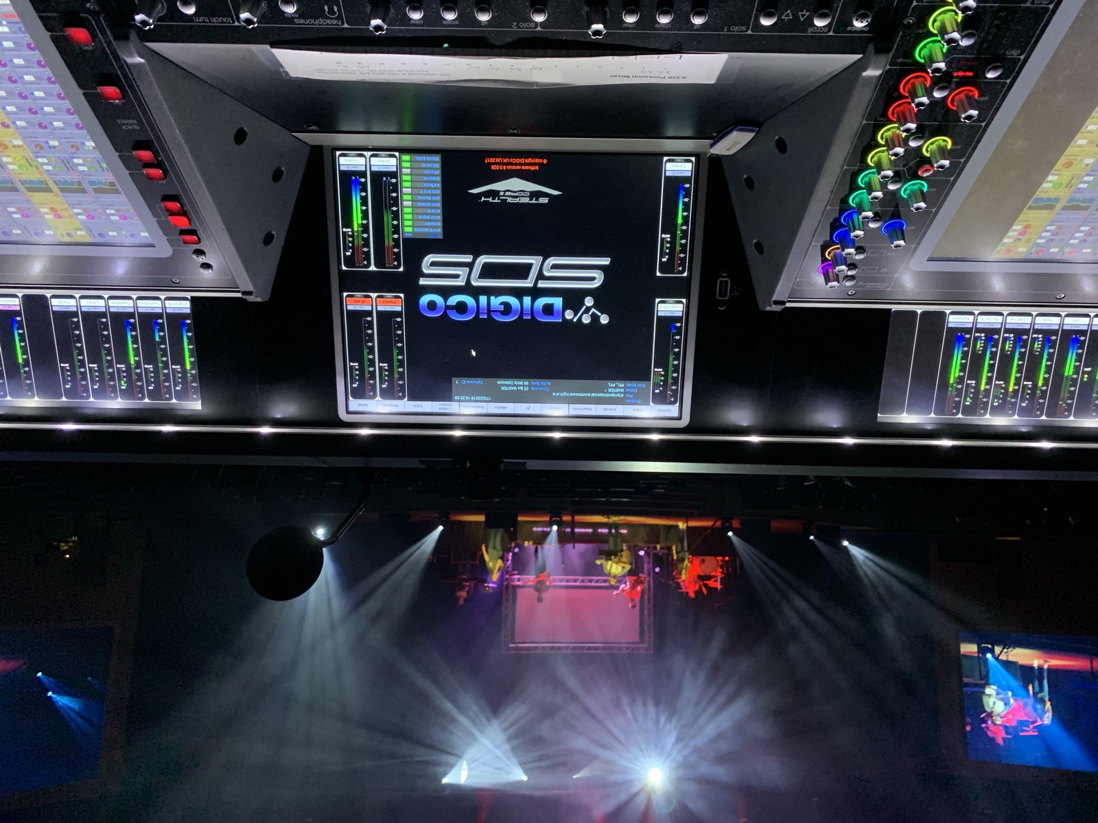 Front of house mixing console at a concert with the band on stage