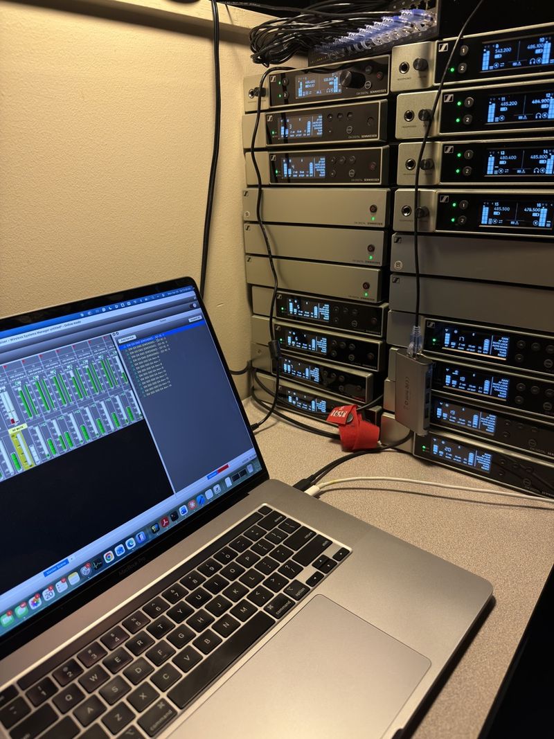 Rack of wireless microphone receivers managed from a laptop
